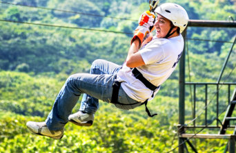 A person ziplining at Camp Butter & Egg